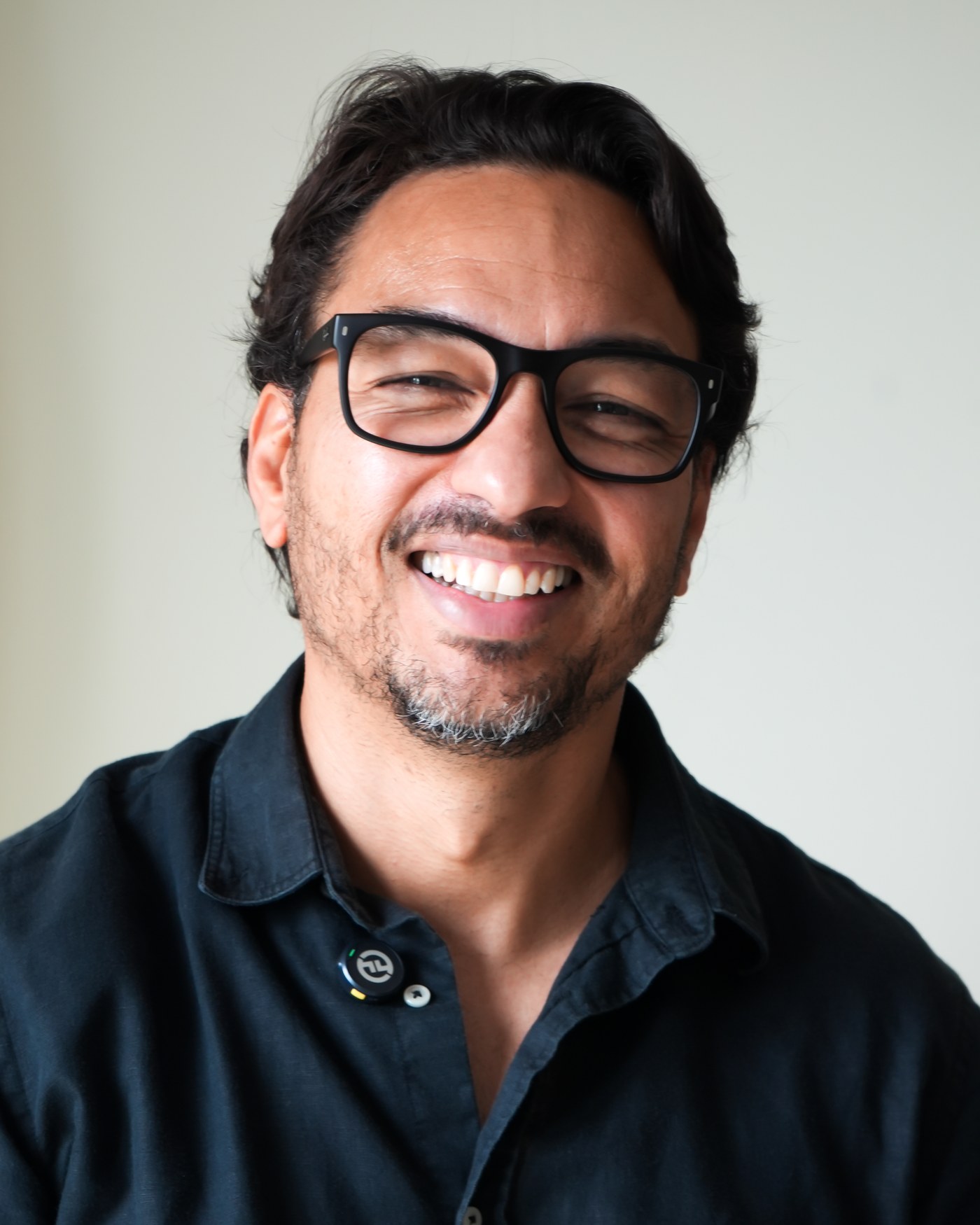 Fabiano Gênio, especialista em consórcio imobiliário para brasileiros na Europa, sorrindo